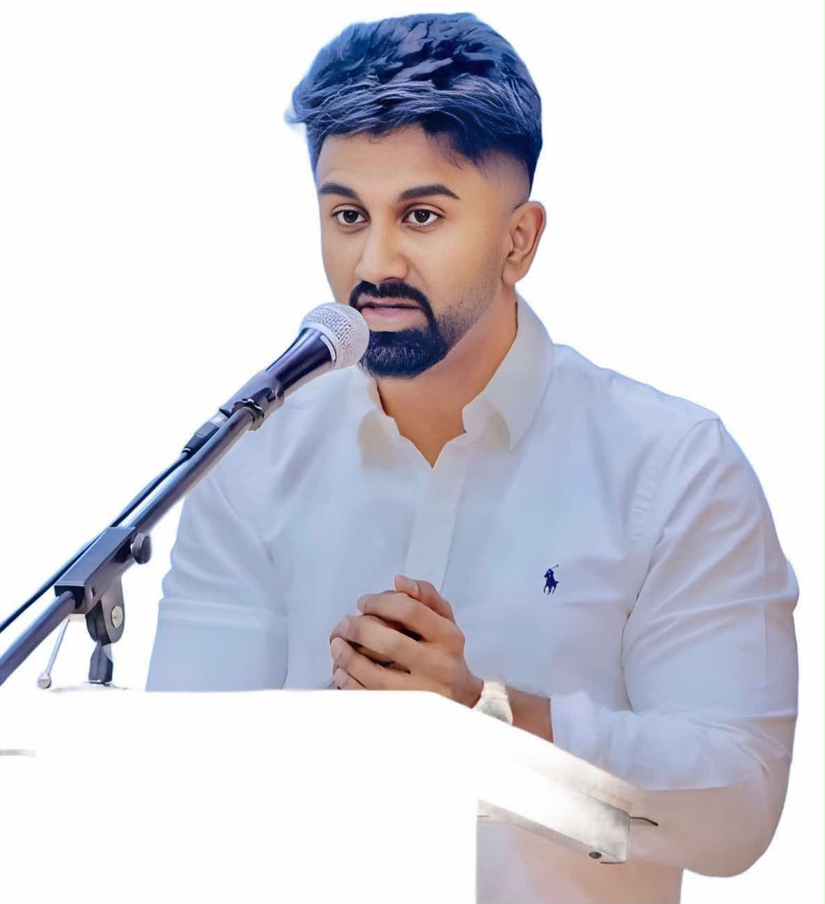 Kasun Kalhara speaking at a lectern